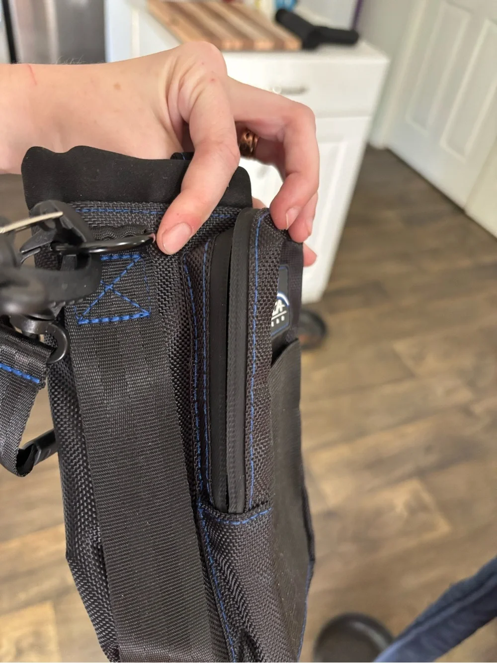 Black and blue water bottle crossbody